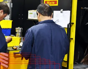MIR machinists at a CNC control station